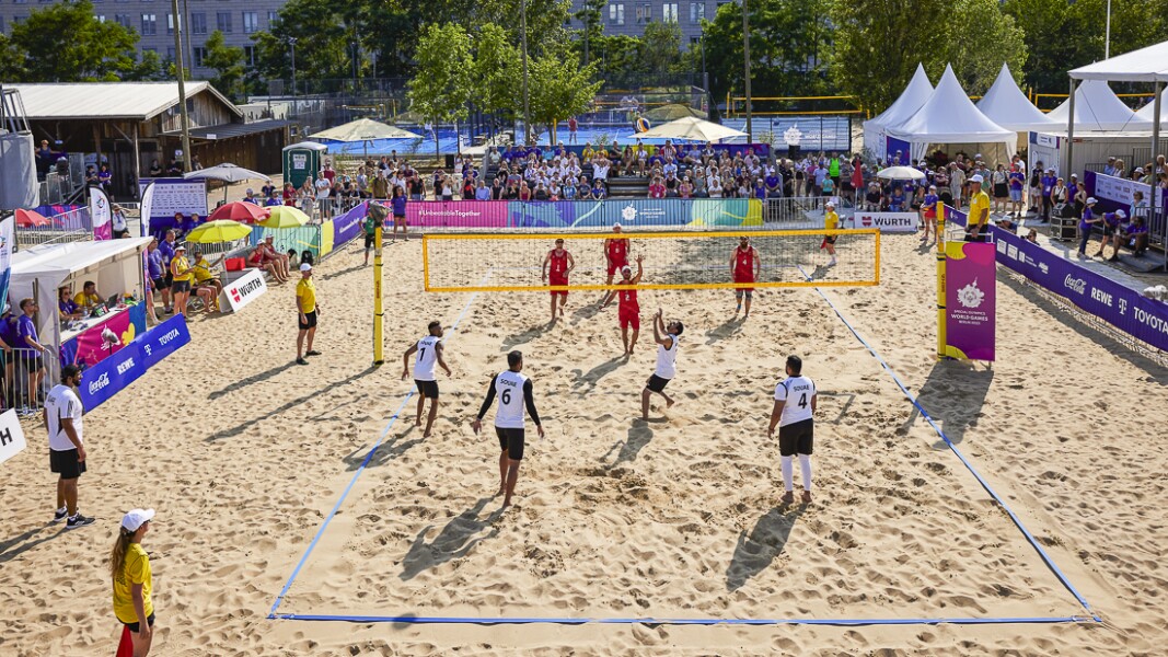 Beach volleyball teams - SO United Arab Emirates in white and SO Germany in red uniform - during the first semifinal of the men's/mixed unified sports team competition.