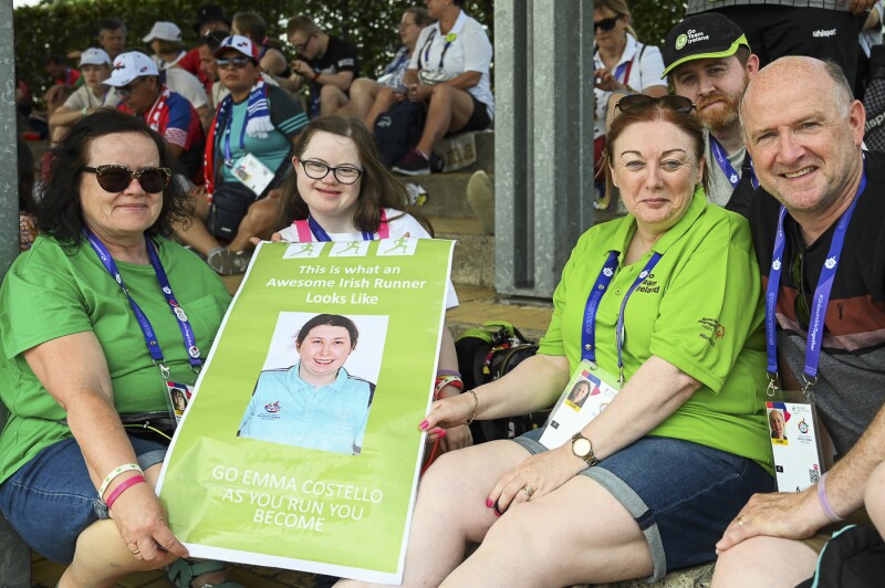 The photo shows the family of Emma Costello from Ireland, who traveled to Berlin to support her. They are holding up a large green poster for Emma.