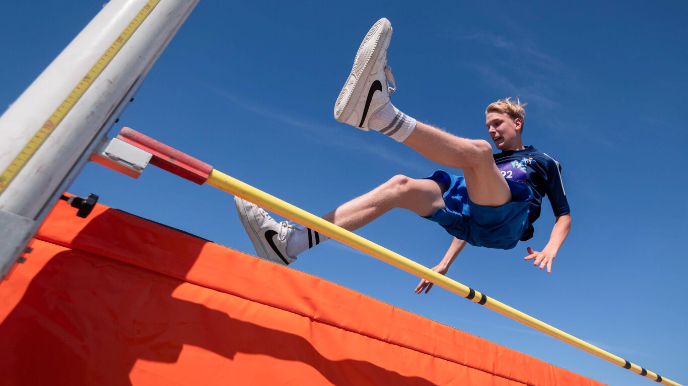 There is an athlete performing high jump during the athletics competitions.