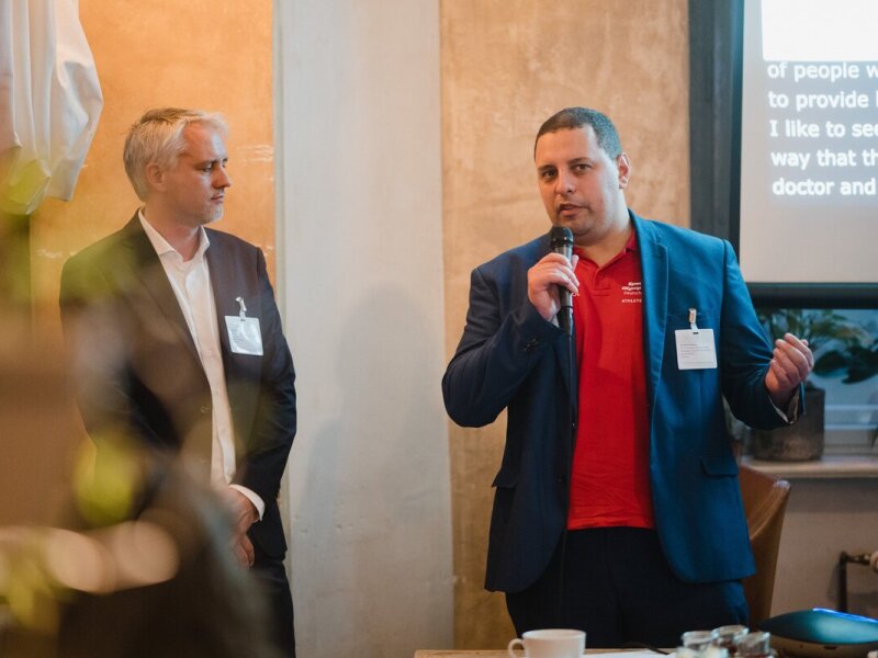 The photo shows SOD Health Ambassador Reynaldo Montoya as he gives a presentation. The photo was taken at a World Health Organization (WHO) conference as part of the 2022 World Health Summit.
