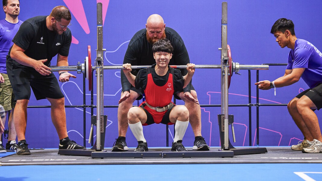 On the picture you can see a male athlete during the execution of a deadlift.