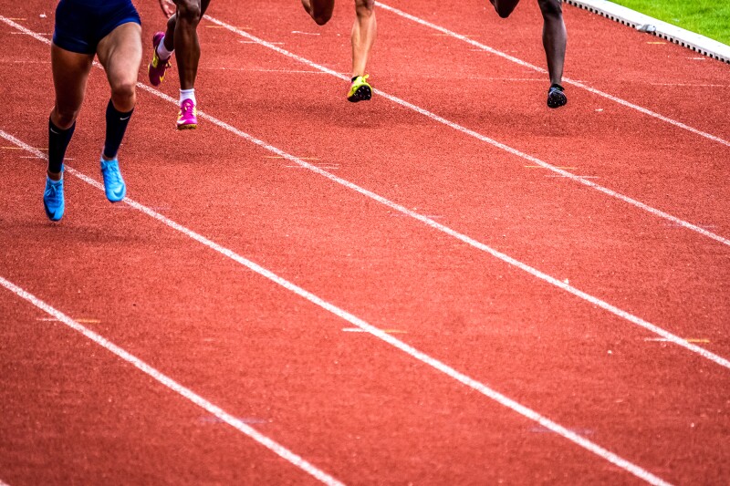 The photo shows a tartan track during an Athletics competition.