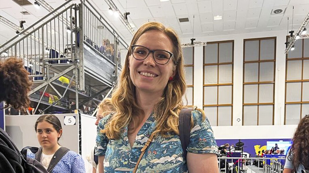 The photo shows a teacher of the FITS program. She looks friendly into the camera.