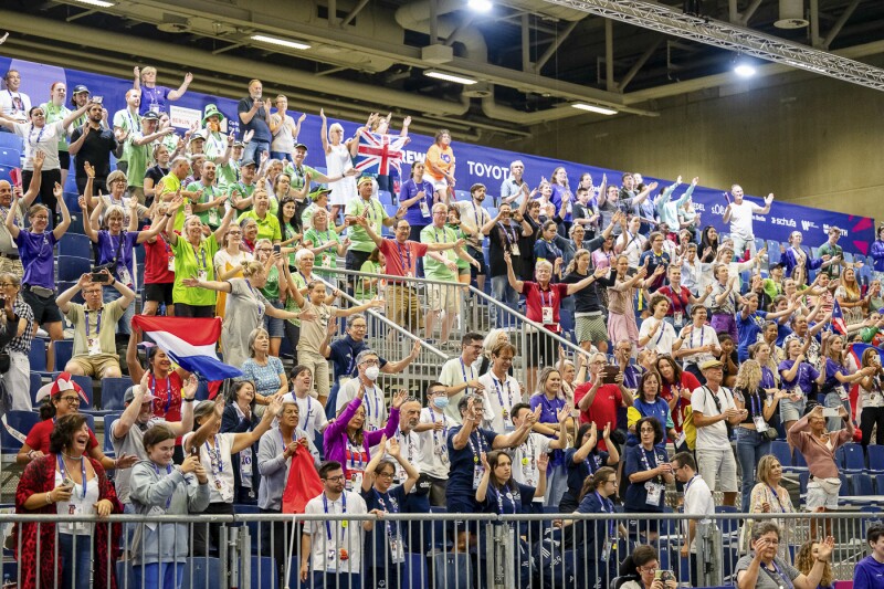 On the photo you can see fans cheering for the athletes.