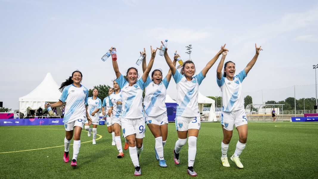 On the picture you can see a female futsal team which is happy.