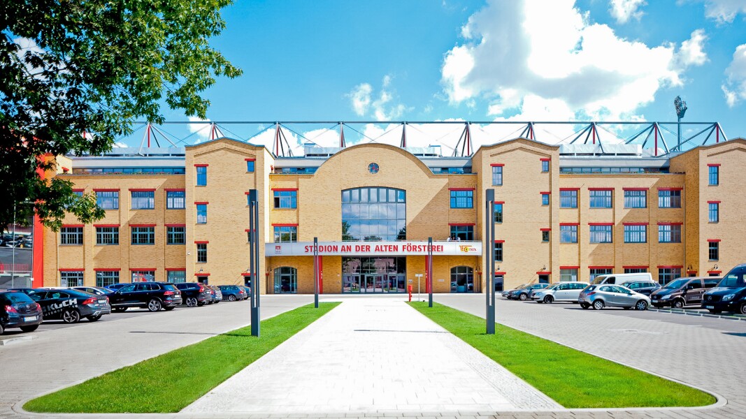 The photo is a frontal shot of the entrance area of the Stadion An der Alten Försterei in the district of Köpenick.