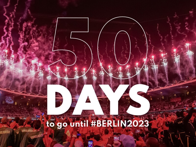 There are many people and fireworks in the photo. And the lettering 50 days to #Berlin2023