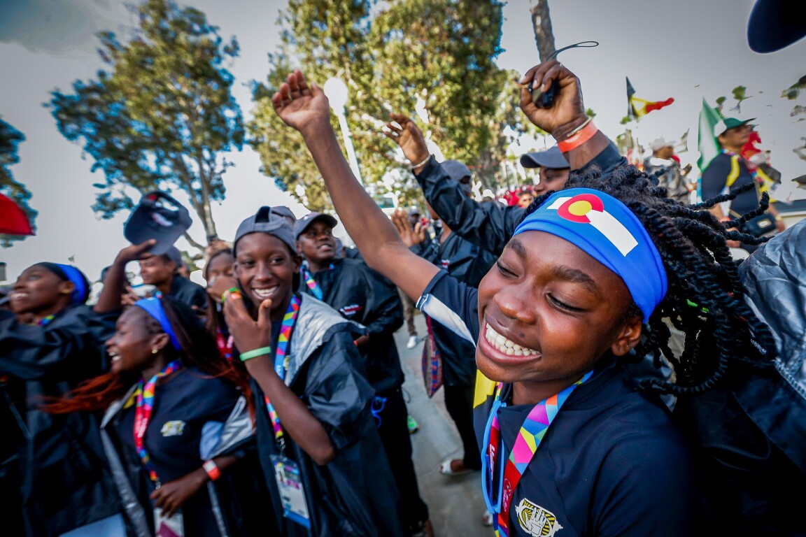 The picture shows athletes celebrating and dancing.