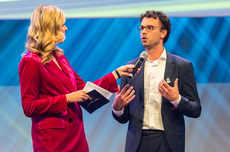 The photo shows Sven Albrecht being interviewed by the presenter at the Champions Gala.