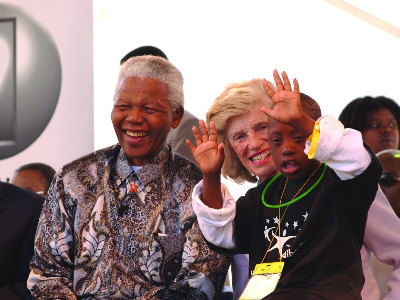 Nelson Mandela and Eunice Kenedy Shriver with a young athlete.