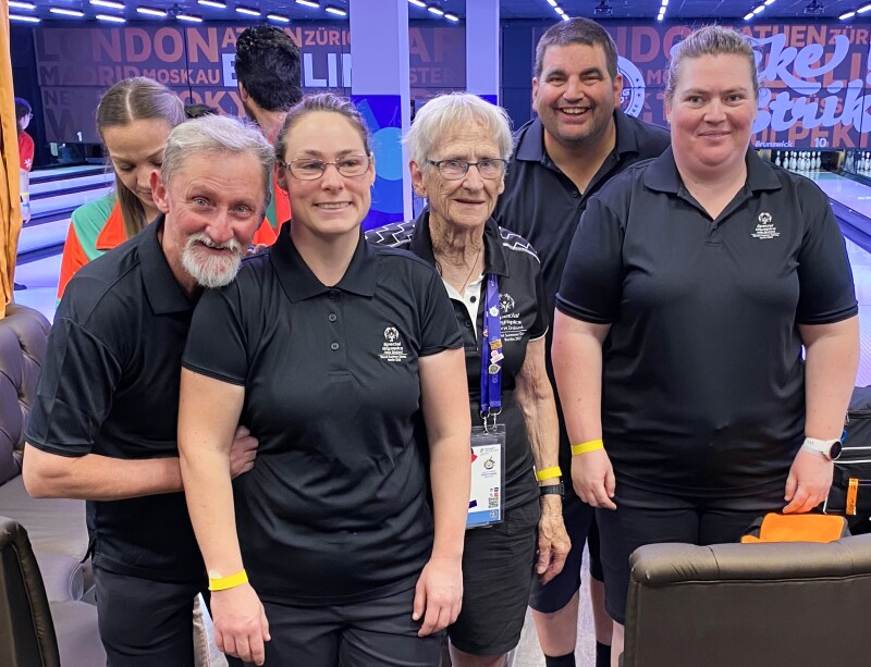 On the picture you can see coaches and supervisors at the bowling competition. 