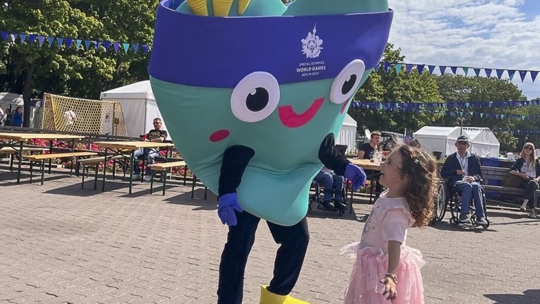 On the photo you can see a little girl. She smiles at our mascot Unity and is very happy.